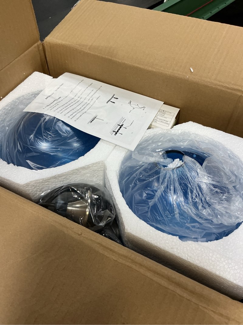 Condition photo showing Good Condition for 7.1in medium blue glass pendant light for kitchen island, 2-pack with extra led bulbs & 4.92ft adjustable cord | modern minimalist lighting for dining room, living room, entryway 2pcs blue seeded pendant light 7.1inch