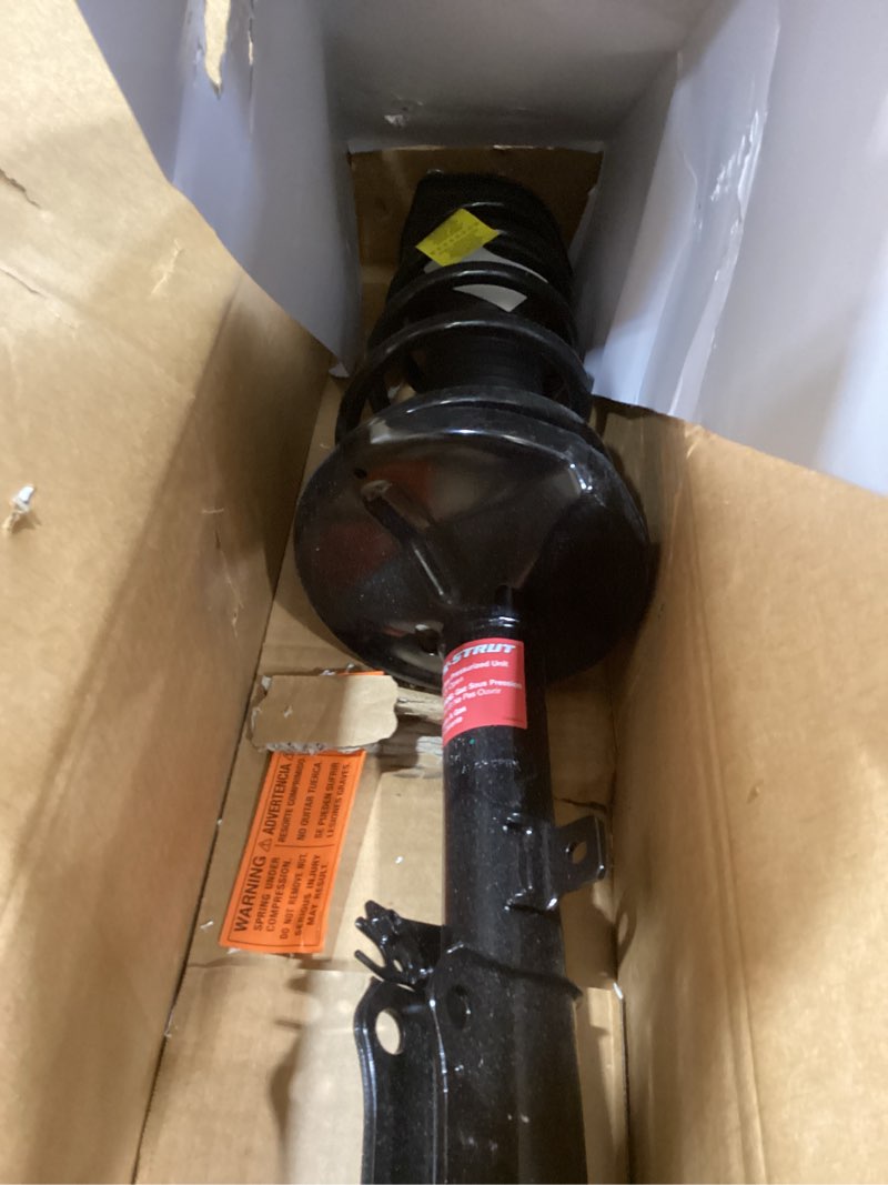 Condition photo showing As Is for Monroe Shocks & Struts Quick-Strut 171493 Strut and Coil Spring Assembly