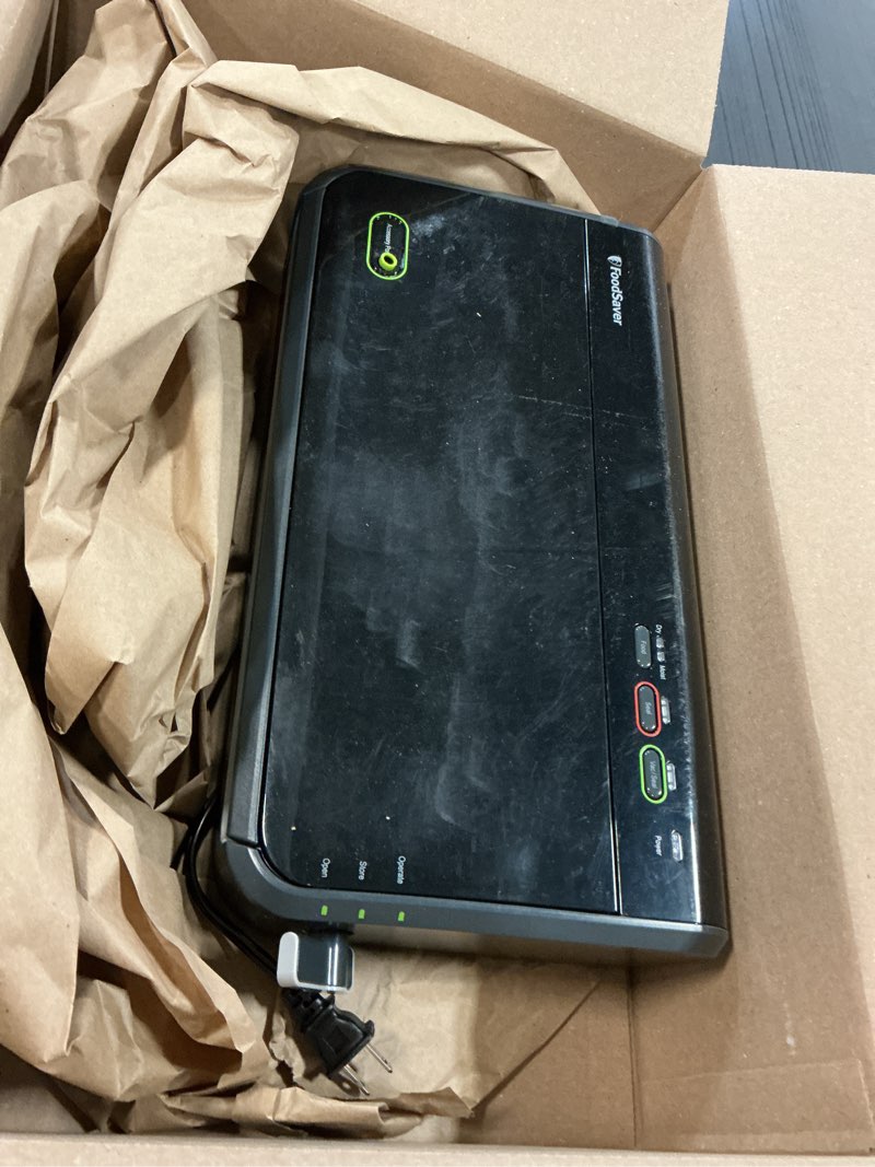 Condition photo showing As Is for FoodSaver Vacuum Sealer Machine, Automatic Bag Detection, Sous Vide Friendly, with sealer bags, roll, handheld vacuum sealer, black