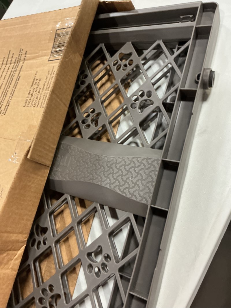 Condition photo showing Good Condition for mypet paws portable pet gate: 26-40" wide expandable, pressure mounted no tools needed, durable dog gate for doorways, made in usa, 23" tall, fieldstone gray