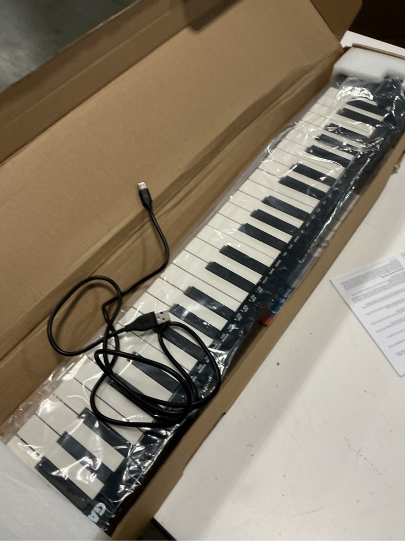 Condition photo showing Good Condition for midi keyboard 49 key, usb midi controller, abs keyboard with daw integration, 8 drum pads, 8 knobs & oled display, perfect for music production md05-49
