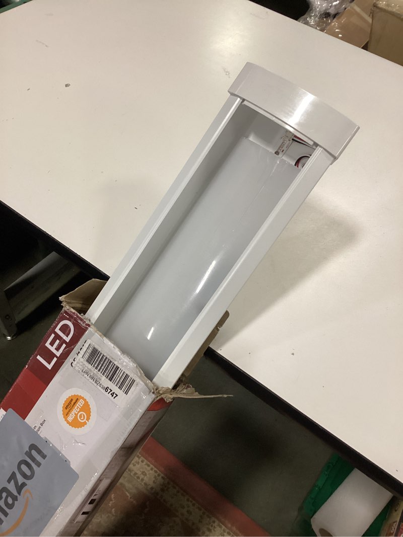 Condition photo showing As Is for Satco 65-1213 4FT LED Ceiling Wrap Light with Pull Chain, 39W, CCT Selectable 2700K–5000K, 3400 Lumens, 120V, White Steel Housing, Polycarbonate Lens, Non-Dimmable, Damp Rated