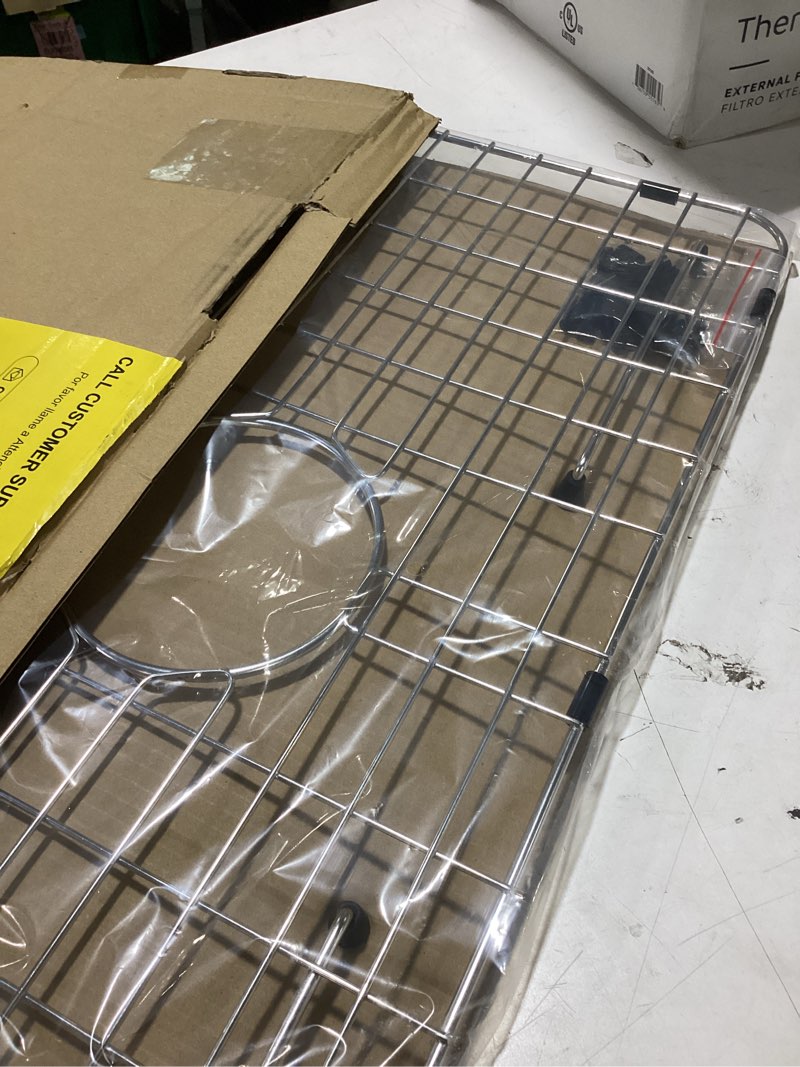 Condition photo showing As Is for sink bottom grid 24-1/8" x 12-5/8", centered drain with corner radius 1-1/2", sink protector for single bowl kitchen sinks 24-1/8" x 12-5/8" centered drain