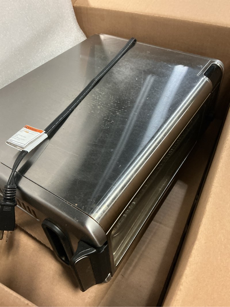 Condition photo showing As Is for Ninja Digital Air Fry Countertop Oven, 8-in-1 Functionality, 1800W, Flip-Up Design, XL Capacity, Air Fry Basket, Wire Rack & Crumb Tray, Silver, SP101 8-in-1 Flip Oven