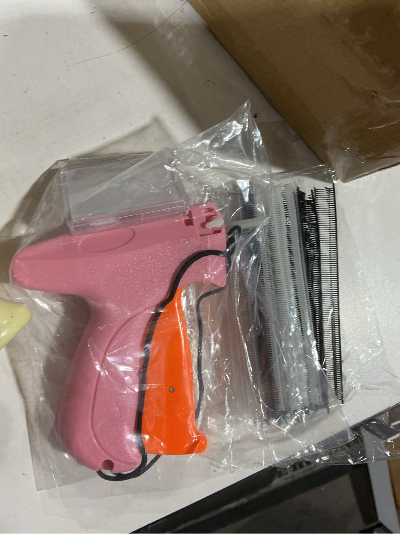 Condition photo showing Good Condition for stitch gun for clothes - handheld stitch gun quick clothing fixer - tagging gun - includes 6 needle, 1000 black fasteners & 1000 white fasteners pink,orange