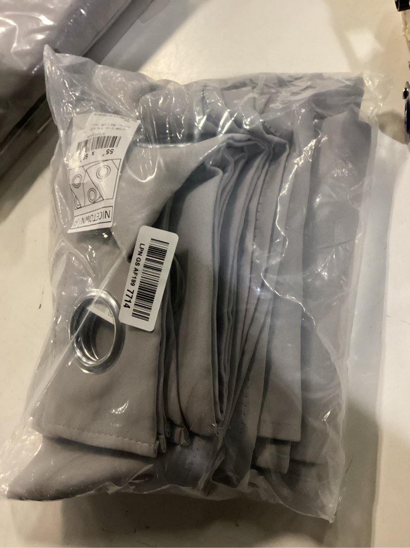 Condition photo showing New/Like New for nicetown silver grey blackout curtain panels for bedroom, thermal insulated grommet top blackout draperies and drapes for basement (2 panels, w55 x l68-inch) silver grey 55"w x 68"l (pack of 2)