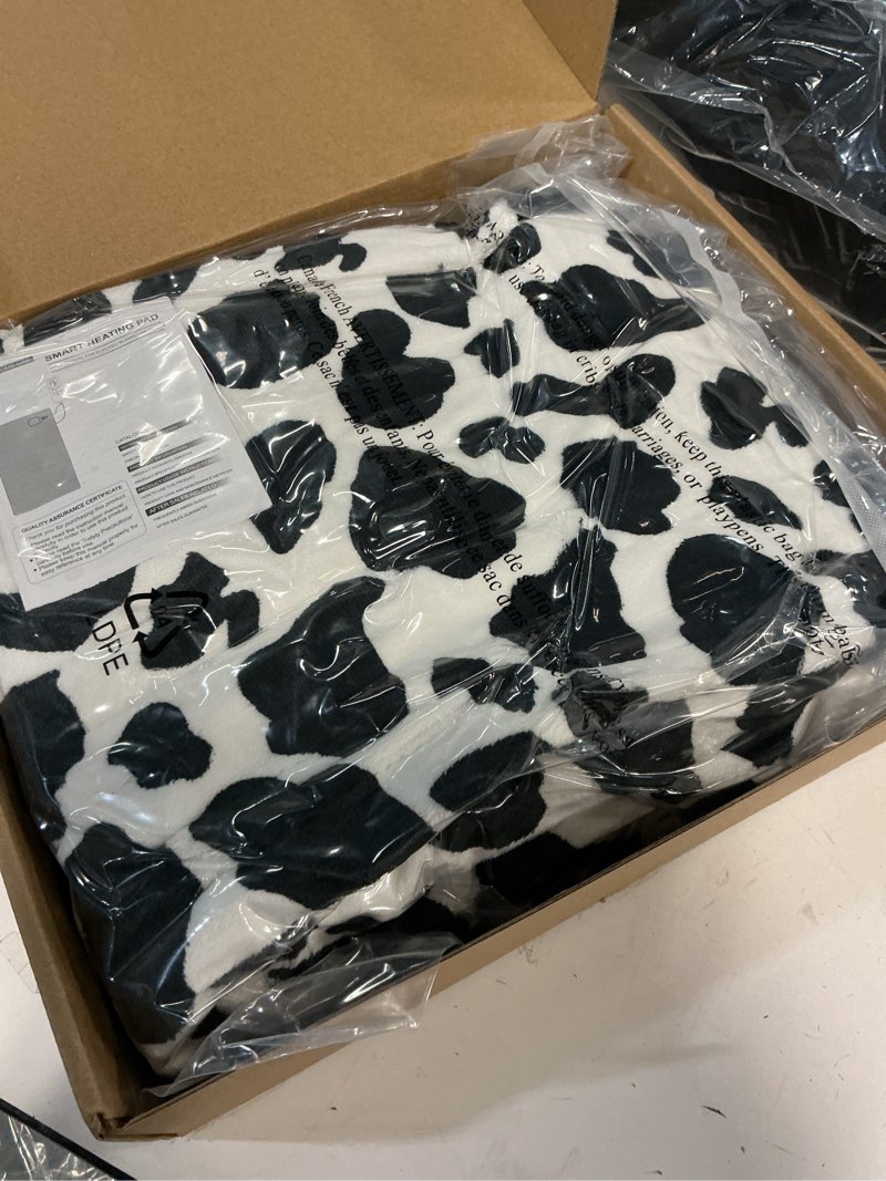 Condition photo showing New/Like New for Heated Wearable Shawl, Heated Blanket Electric Throw for Gifts, 33x59 Inch Super Cozy Soft Wearable Blanket with 6 Heating Levels & 5 Timer Settings, Auto Shut Off, Machine Wash (Cow Print)