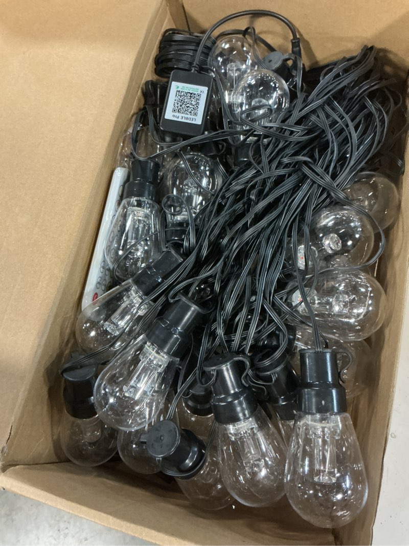 Condition photo showing Good Condition for beizelte outdoor string lights, 150ft rgb+ic outside light dimmable shatterproof led bulbs, ip67 waterproof chasing effect lighting dreamcolor patio strip lights for backyard, balcony, outdoor living