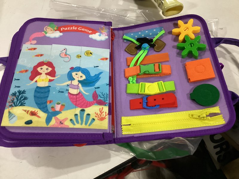 Condition photo showing New/Like New for busy board montessori toys for toddler boy girl birthday gifts, busy book sensory learning toys for toddlers, educational activities airplane car travel toy for toddlers purple