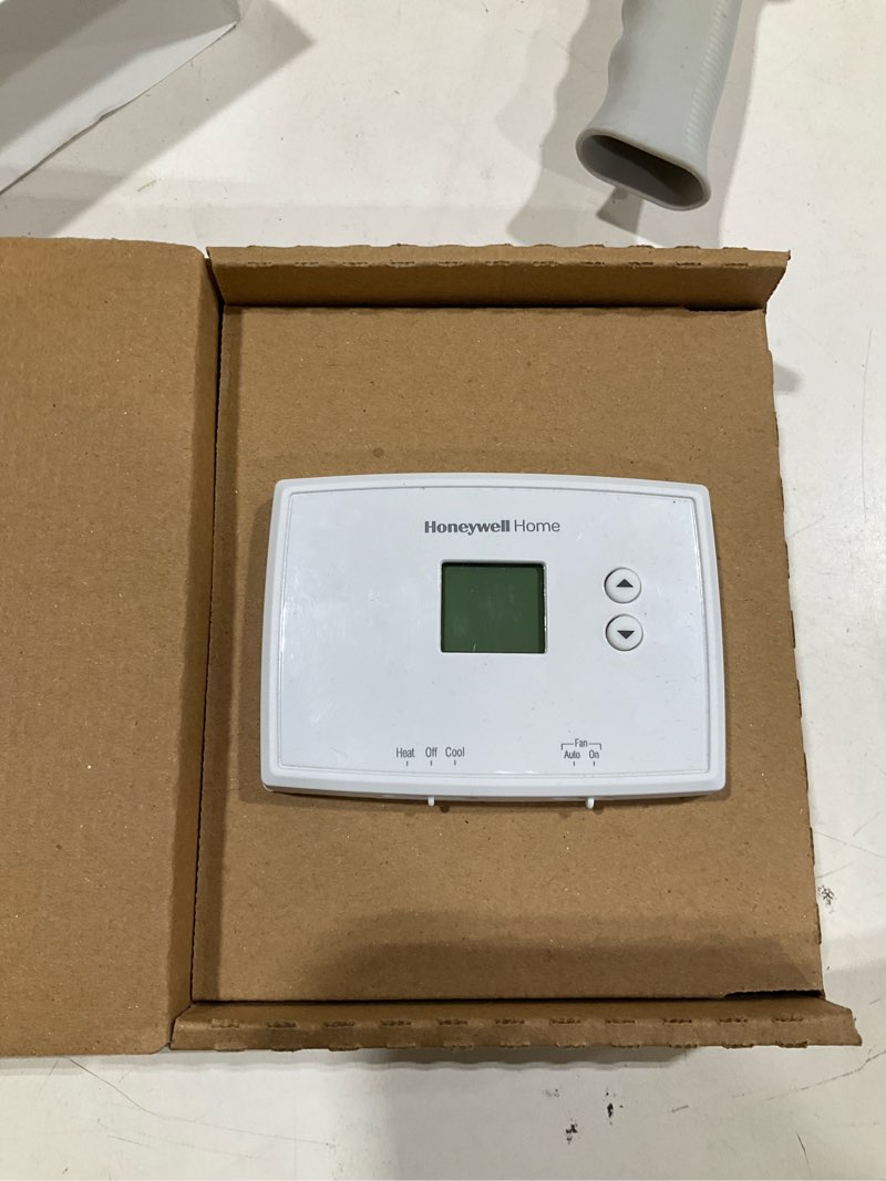 Condition photo showing As Is for honeywell home electronic non-programmable thermostat