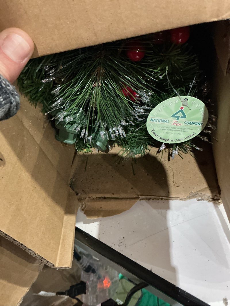 Condition photo showing Good Condition for national tree company 9 ft pre-lit crestwood spruce artificial christmas garland, christmas decoration with glitter, pinecones, red berries, 50 clear lights, 180 tips, green plug in tree