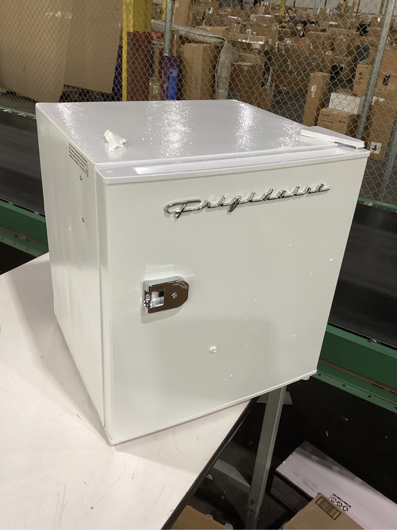 Condition photo showing As Is for Frigidaire Retro Compact Fridge with Chiller, Countertop, Built-In Bottle Opener, Compact Refrigerator 1.6 cu ft, Mini Fridge for Office, Bedroom, Dorm Room or Cabin - 16" D x 18" W x 18.5" H (White)