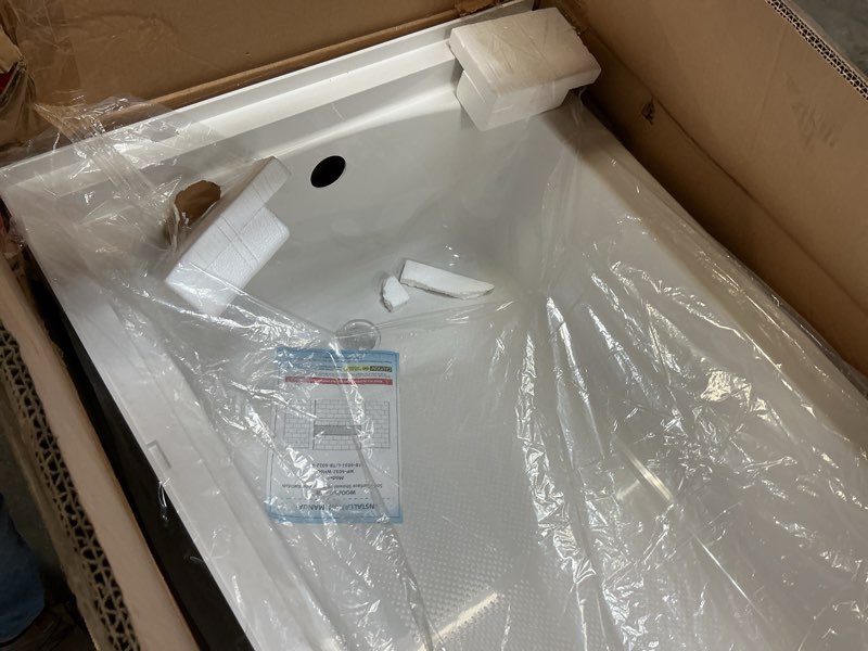 Condition photo showing As Is for WOODBRIDGE 60” x 32” Four-Piece Direct-to-Stud Alcove Tub Surround with Right-Drain Hole Soaking Bat