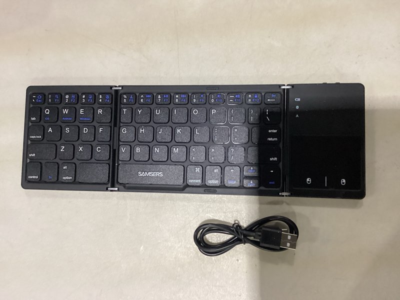 Condition photo showing As Is for samsers foldable bluetooth keyboard with touchpad - portable wireless keyboard with holder, rechargeable full size ultra slim pocket folding keyboards for android windows ios tablet & laptop - black bt x1 black
