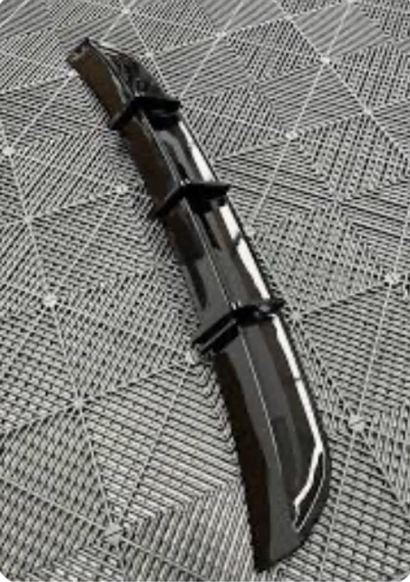 gloss black rear bumper diffuser, also referred to as a rear bumper extension or spoiler (for unknown vehicle)(similar to stock photo)