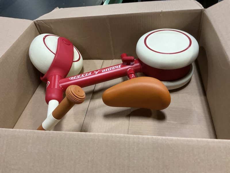 Condition photo showing New/Like New for radio flyer steady start balance bike, red, for kids ages 1-3, pedal free for quick learning, wide front and dual rear tires, tool-free adjustable seat, quiet ride wheels, kid & toddler balance bikes