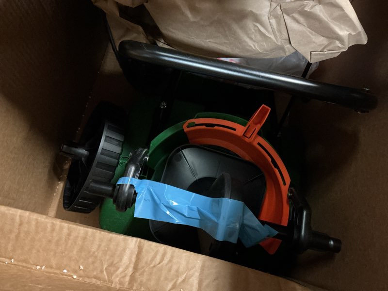 Condition photo showing As Is for scotts turf builder edgeguard mini broadcast spreader for seed, weed and feed, fertilizer, salt, ice melt, push spreader holds up to 5,000 sq.ft. product