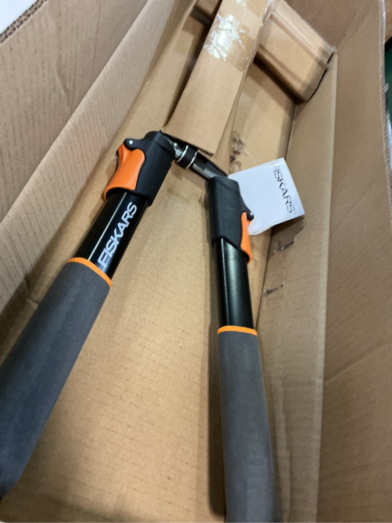 Condition photo showing Good Condition for fiskars power-lever extendable hedge shears, self-sharpening serrated steel blades for clean cuts, handles adjust 25"-33" for high reach, multiplies leverage for 2x power, 10" blades, orange/black 25-33" power-lever