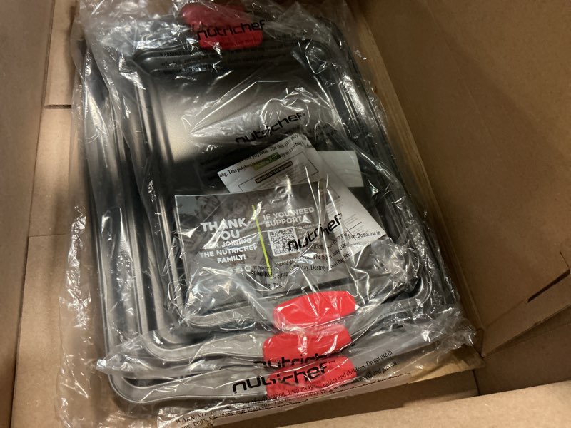 Condition photo showing Good Condition for nutrichef 3-piece nonstick kitchen oven baking pans - premium & stylish non-stick steel, commercial grade restaurant quality metal bakeware with red silicone handles - easy to clean, ncsbs3s