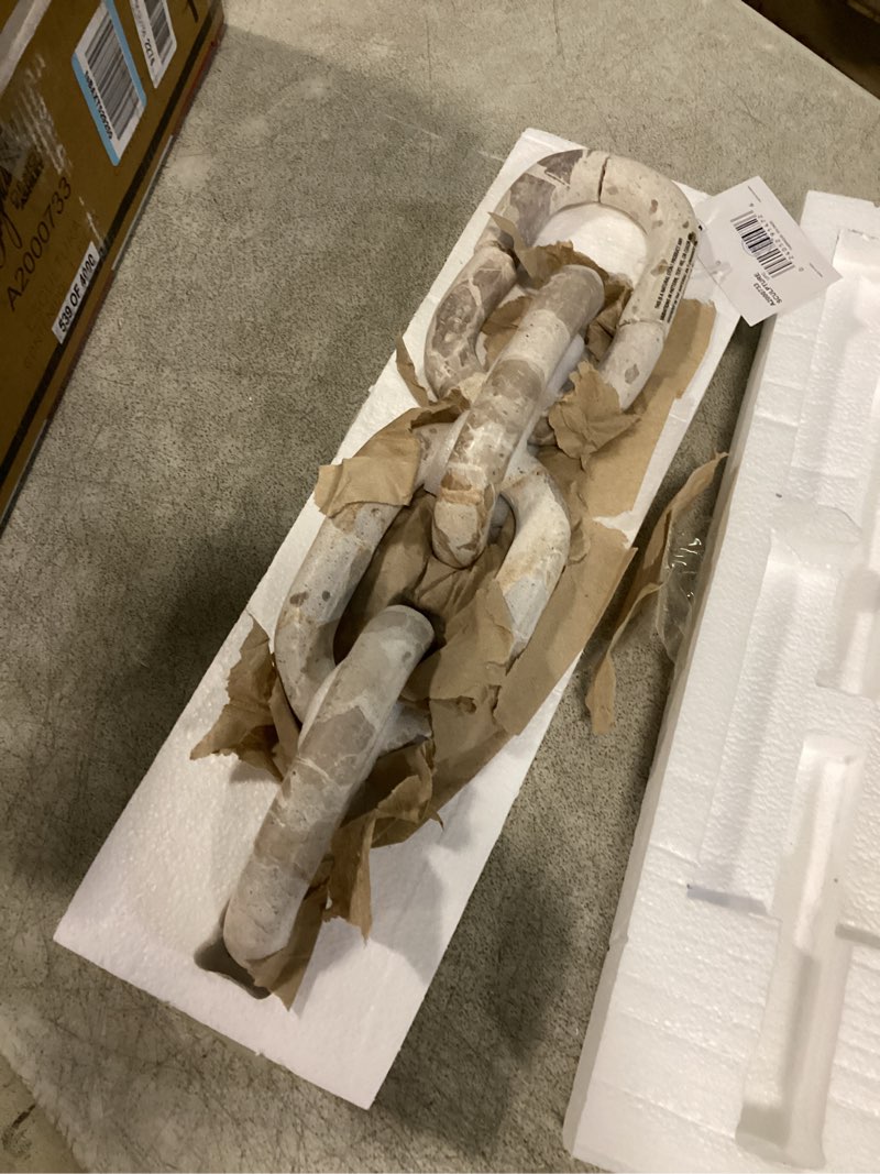 Condition photo showing As Is for signature design by ashley kenport contemporary marble chain sculpture, light beige