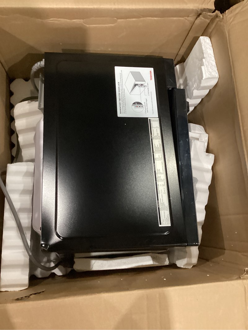 Condition photo showing As Is for toshiba em131a5c-bs countertop microwave ovens 1.2 cu ft, 12.4" removable turntable smart humidity sensor 12 auto menus mute function eco mode easy clean interior black color 1000w 1.2 cu.ft