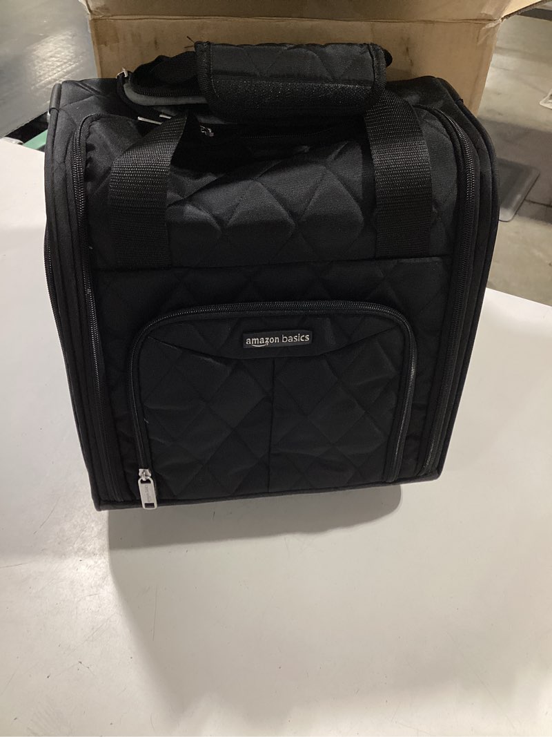 Condition photo showing Good Condition for amazon basics underseat carry-on luggage with wheels, 14" rolling travel bag with compartments and handle, airline compliant, front pocket, black quilted