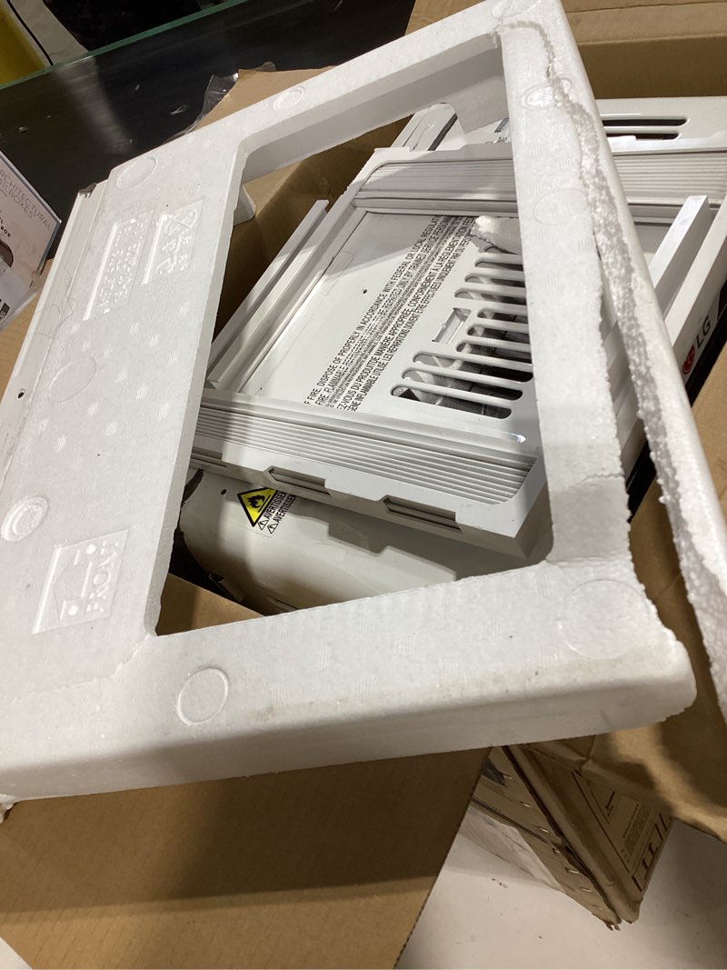 Condition photo showing As Is for lg 5000 btu window air conditioner with remote, easy button control ultra-quiet compact-size cools 150 sq.ft. for small room, washable filter ac unit easy installation white lw5025r