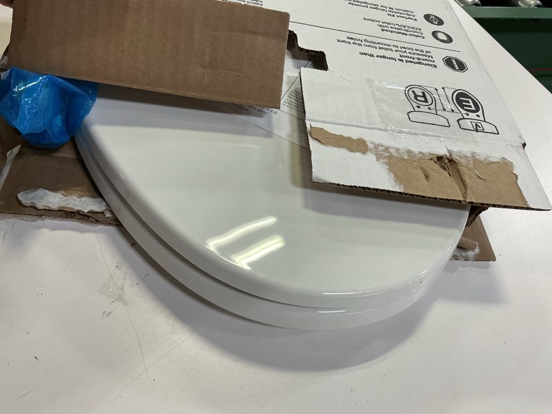 Condition photo showing As Is for kohler k-20110-0 brevia elongated toilet seat with grip-tight bumpers, quiet-close seat, quick-attach hardware, white
