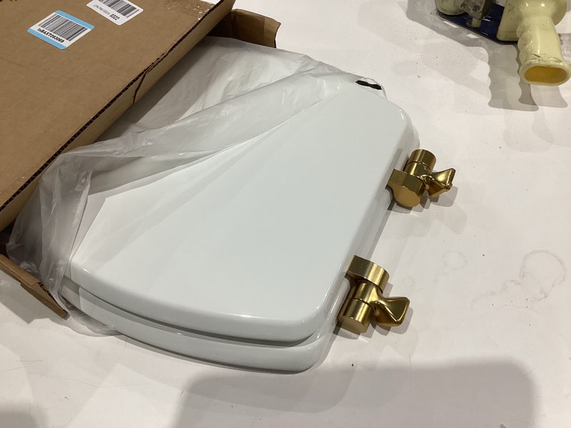 Condition photo showing Good Condition for Mayfair Bennett Toilet Seat with Brushed Gold Hinges, Slow Close Wood Seat, Secure Metal Hinges, Easy Install, Made in USA, Elongated, White Elongated Gold