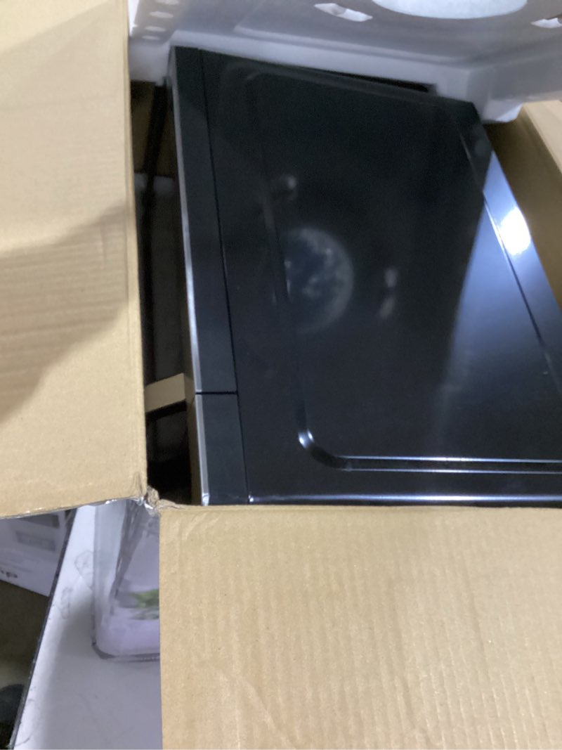 Condition photo showing Good Condition for Farberware 0.7 Cu. Ft. Countertop Microwave Oven – 700 Watts Power, Auto Cook Settings, Defrost, Easy Clean and Child Safety Lock - Stainless 0.7 Cu. Ft Stainless Steel