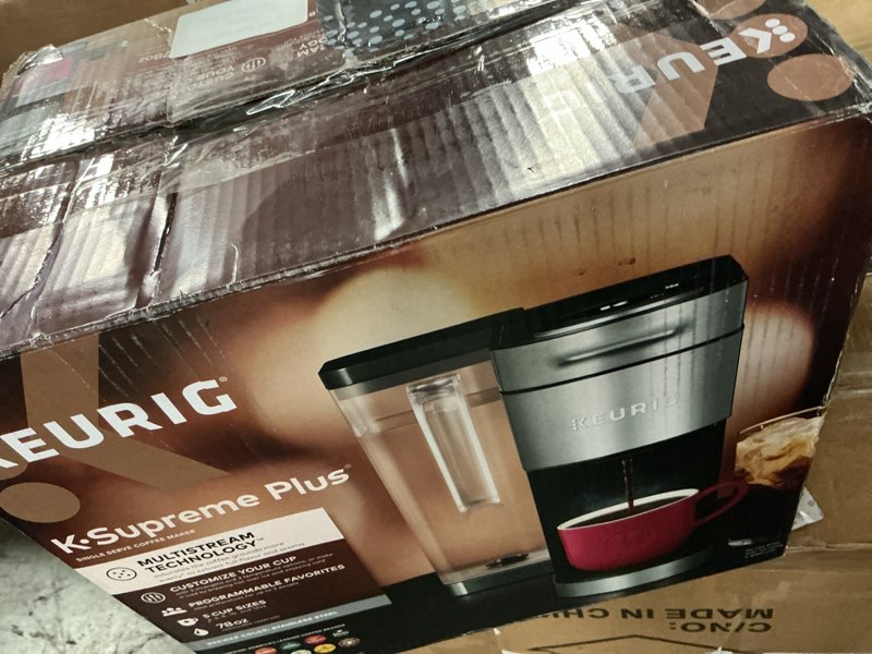 Condition photo showing As Is for keurig k-supreme plus single serve k-cup pod coffee maker, multistream technology, customizable strength and temperature settings, programmable, 78oz removable reservoir, stainless steel stainless steel maker