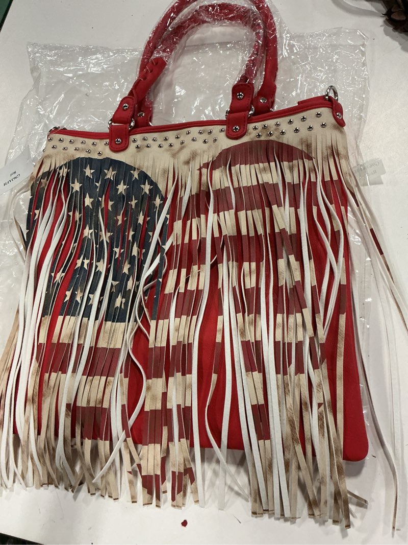 Condition photo showing New/Like New for restocked-- celebrity usa flag fringe tote