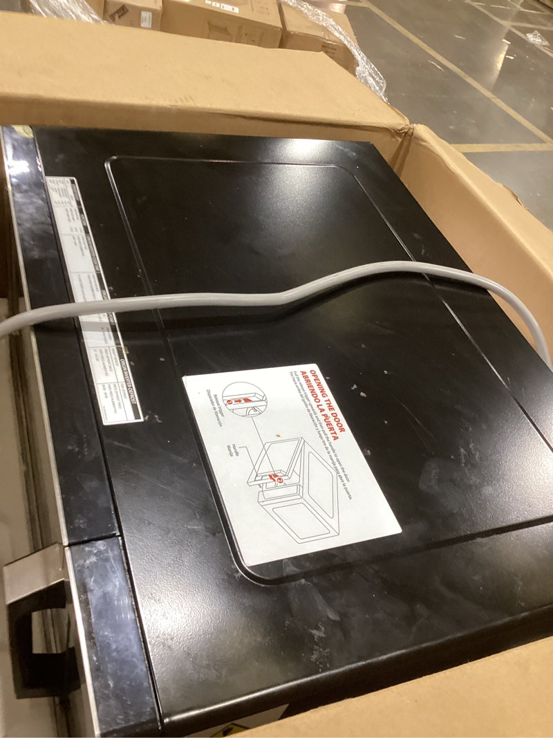 Condition photo showing As Is for toshiba ml-em45pit(ss) countertop microwave oven with inverter technology, kitchen essentials, smart sensor, auto defrost, 1.6 cu.ft, 13.6" removable turntable, 33lb.&1250w, stainless steel inverter-1.6 cu. ft.