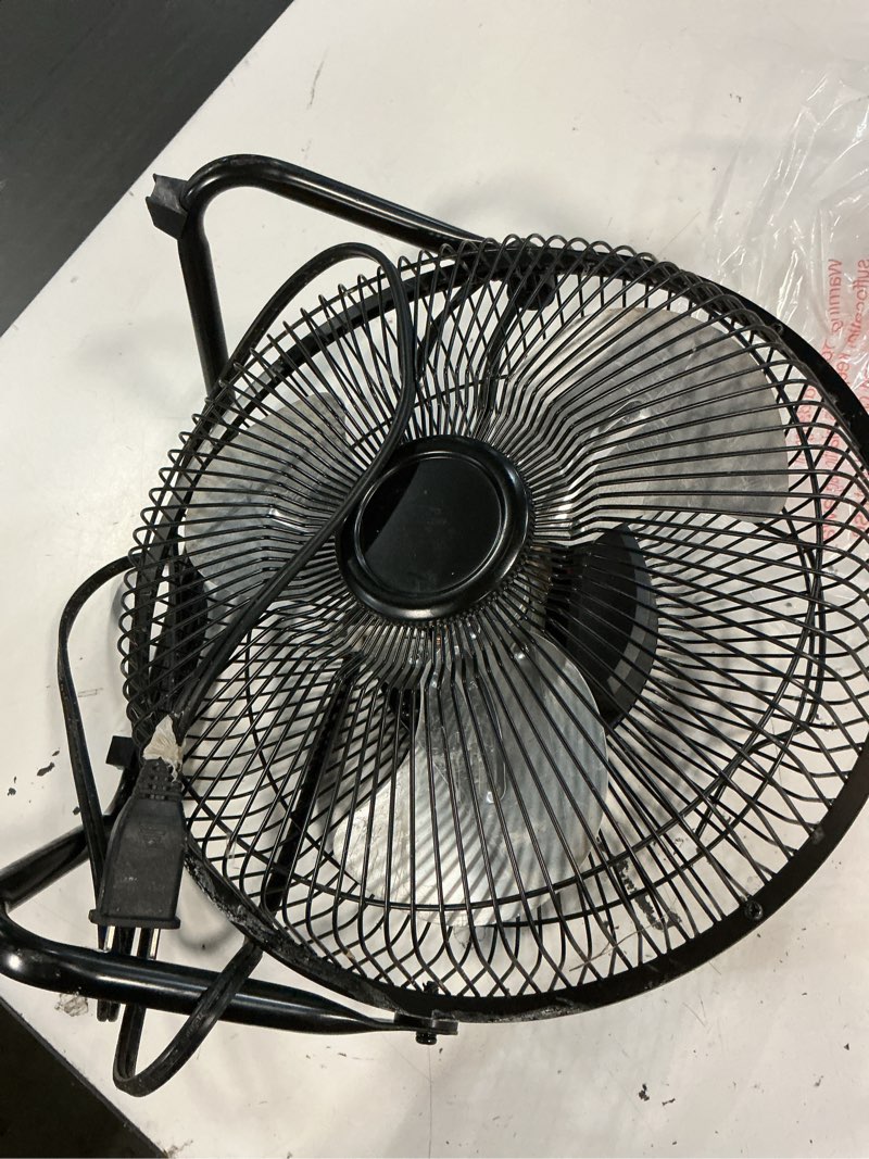 Condition photo showing As Is for mainstays 9 in high velocity floor fan wall mount black