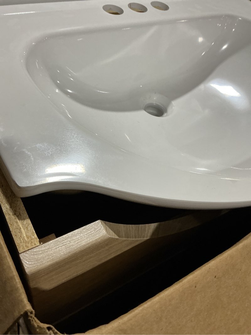 Condition photo showing As Is for style selections euro 24-in sandstone single sink bathroom vanity with white cultured marble top