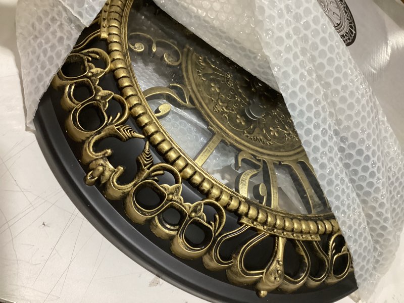 Condition photo showing Good Condition for ANDSTAR 20 Inch Roman Numeral Wall Clock - Silent Non-Ticking Metal Frame with Glass Face, Battery Operated Vintage Decor for Living Room, Bedroom & Office (Antique Gold) Gold 20 inch