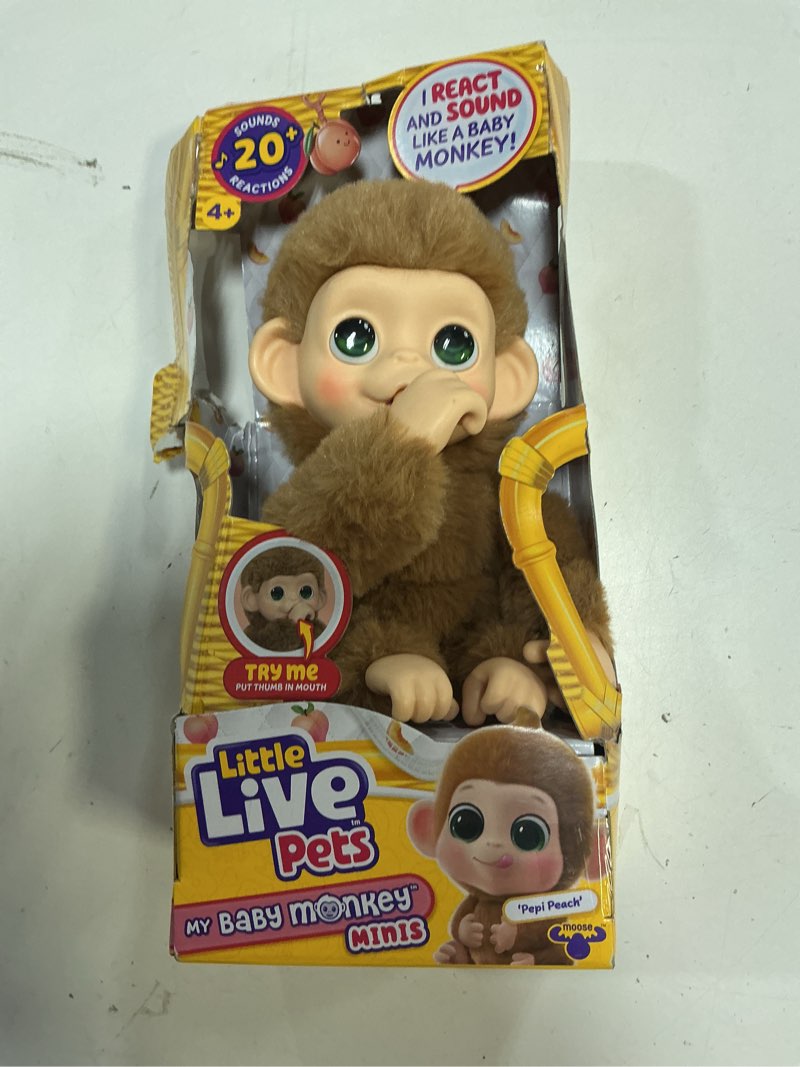 Condition photo showing Good Condition for little live pets baby monkey minis – pepi peach. interactive pet toy. 20+ sounds & reactions. soft brown fur, 7.4" tall. super realistic. feed, nurture, react. grippy hands & feet. collect all 3