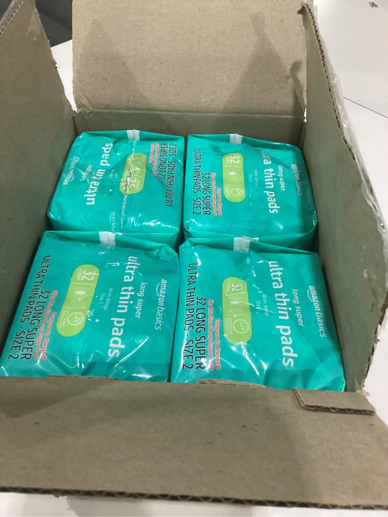 Condition photo showing As Is for amazon basics menstrual pads for women with flexi-wings, long length, size 2, super absorbency, 4 packs of 32 count size 2