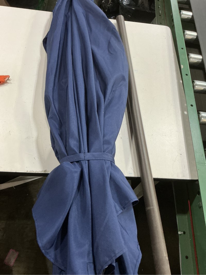Condition photo showing As Is for 9-foot outdoor patio umbrella