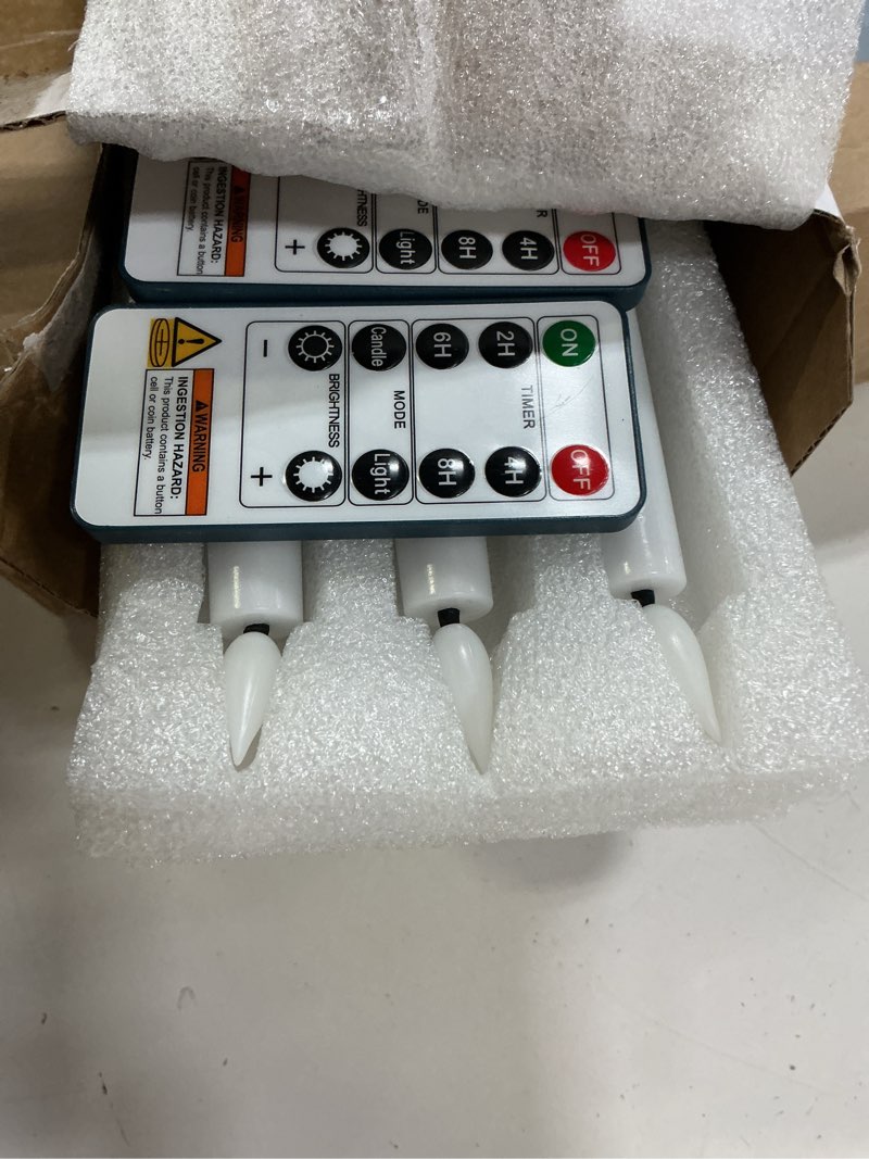 Condition photo showing Good Condition for homemory 6 pcs waxy flameless taper candles with remote, led candlesticks classic tall candle, flickering battery operated taper candles for bedroom, dining room, white, 9.6 inches classic - white 9.6"