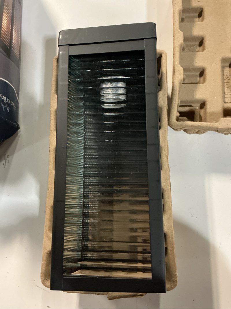 Condition photo showing As Is for allen + roth sutter 1-light 12.6-in h matte black outdoor wall light