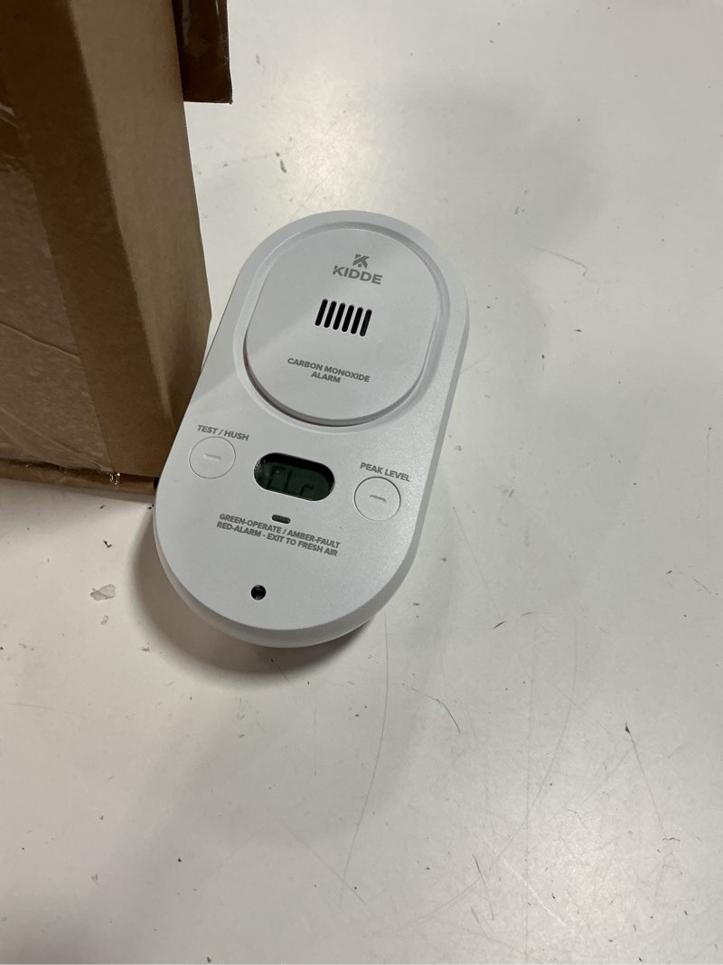 Condition photo showing Good Condition for kidde carbon monoxide detector, plug-in with aa battery backup, easy-to-read digital backlit display, 85 db alarm, rotating plug, led status light indicators, 5th edition, copd 1 pack 5th edition