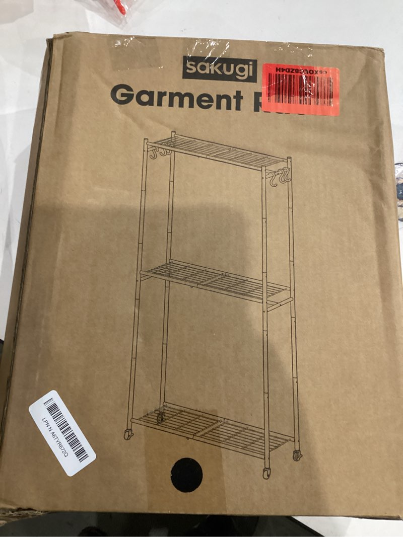 Condition photo showing Good Condition for Clothes Rack - 33.0" x 12.2" x 79.5" Clothing Rack with Shelves & Wheels, Multi-Functional Wardrobe Closet with Hooks, Sturdy Metal Garment Rack for Bedroom, Laundry, Balcony (Black) Black Large
