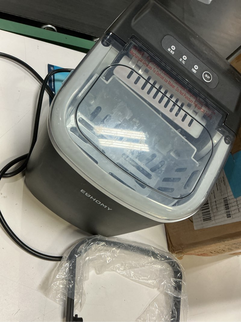 Condition photo showing As Is for EUHOMY Countertop Ice Maker Machine with Handle, 26lbs in 24Hrs, 9 Ice Cubes Ready in 6 Mins, Auto-Cleaning Portable Ice Maker with Basket and Scoop, for Home/Kitchen/Camping/RV. (Black) Black 26lbs