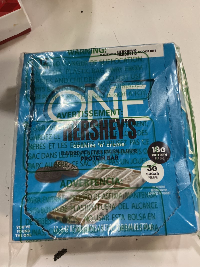 Condition photo showing As Is for (bb 09/2026)one protein bars, hershey's cookies 'n' creme, gluten free with 18g protein and 3g sugar, pantry staples, 2.12 oz (12 count) hershey's cookies 'n' crème