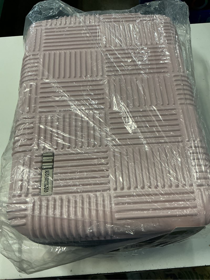 Condition photo showing New/Like New for american tourister nxt checkered hardside carry on spinner suitcase - pink