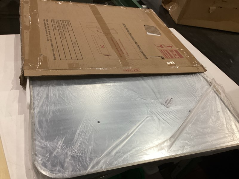 metal framed rounded rectangle mirror