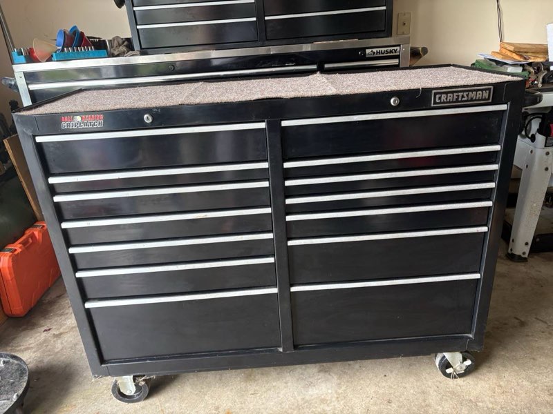 this is a craftsman black rolling tool cabinet featuring multiple drawers black