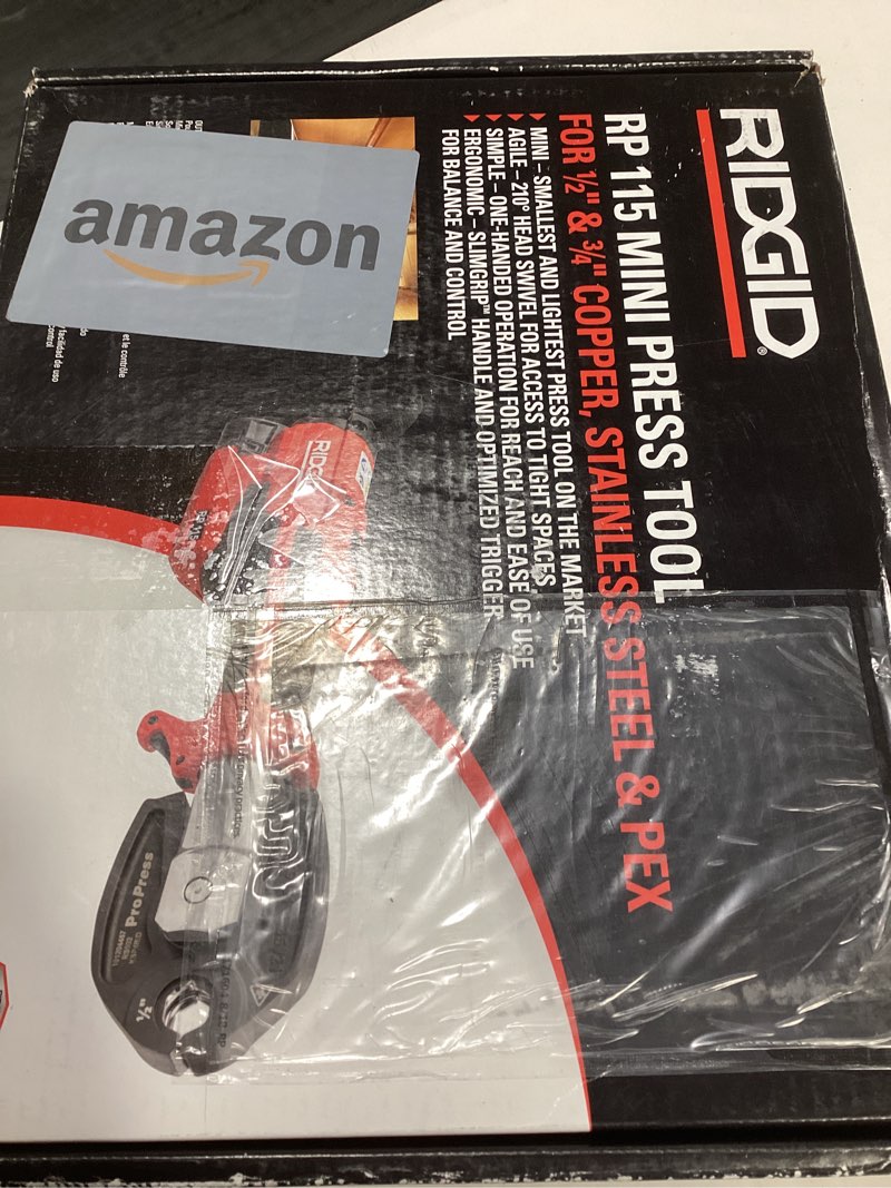 Condition photo showing Good Condition for RIDGID 72553 Model RP 115 Mini Press Tool and Battery Kit with 1/2" to 3/4" ProPress Press Tool Jaws, 2V Li/Ion Battery, 12V Charger, and Carrying Case , Red Mini Press Tool Kit (1/2" - 3/4" Jaws Capacity