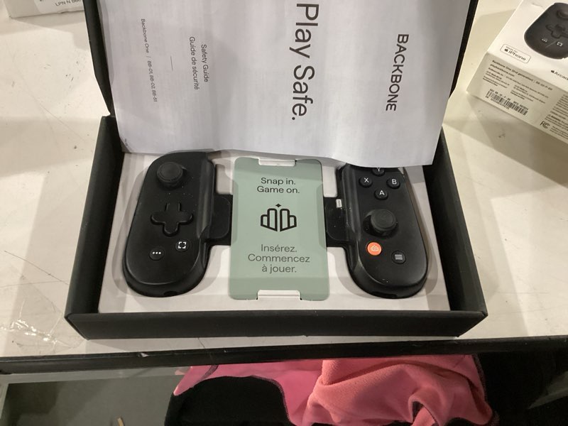 Condition photo showing New/Like New for BACKBONE One Mobile Gaming Controller for iPhone (Lightning) - 2nd Gen - Turn Your iPhone into a Gaming Console - Play Xbox, PlayStation, PC, & App Games (3 Months Apple Arcade Included)